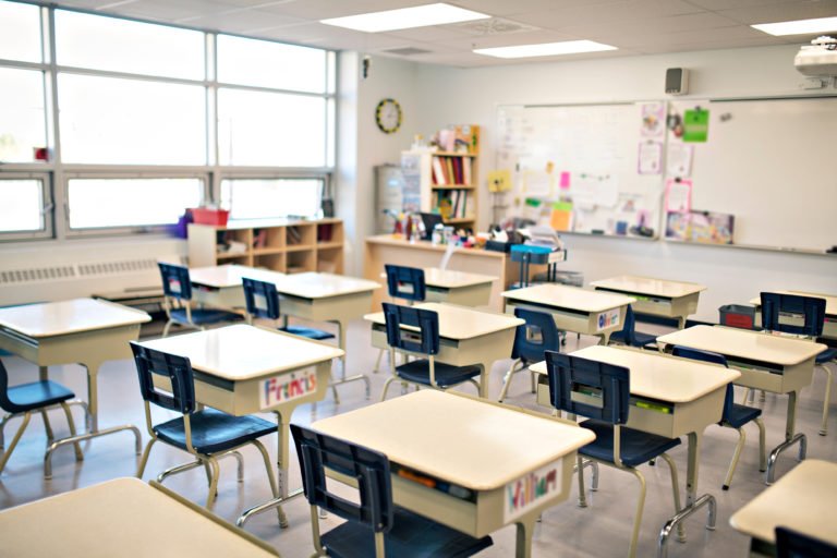 Classroom with rows of empty desks