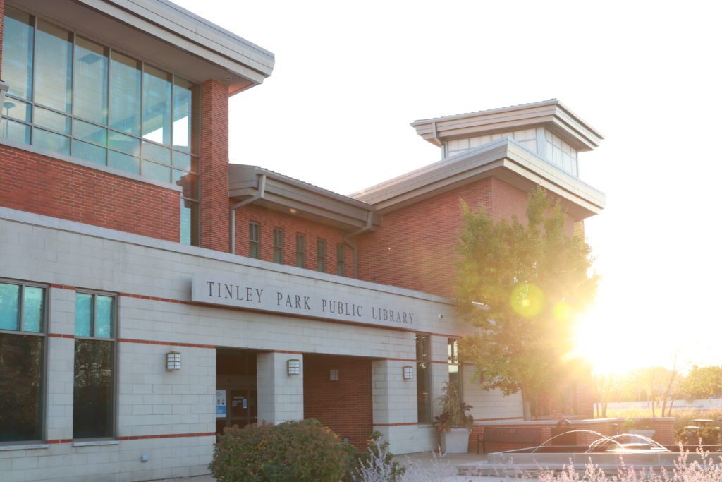 The front of the Tinley Park Public Library building at sunset