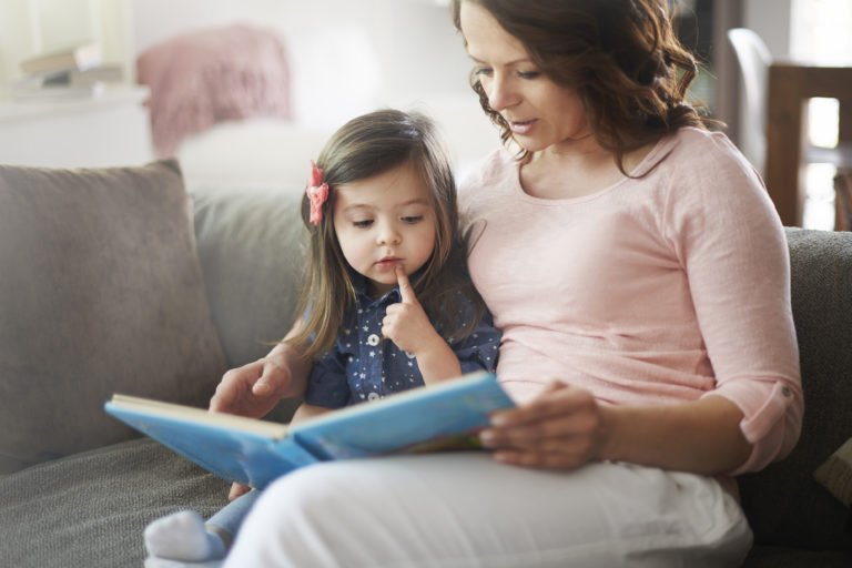 parent reading to small child