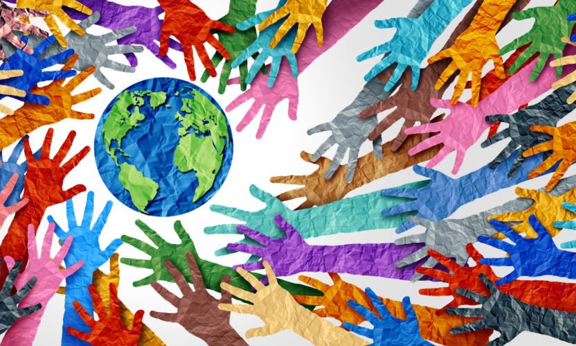 paper art with brightly colored hands surrounding a globe