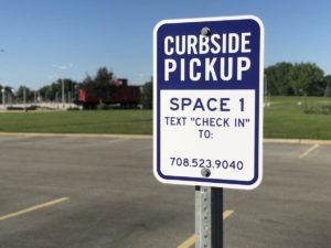 Parking sign: Curbside Pickup Space 1