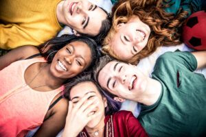 Group of teens laughing outdoors