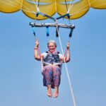 Woman enjoying her retirement by paragliding