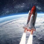 Space shuttle launch in the open space over the Earth. Ocean and sky under space ship. 