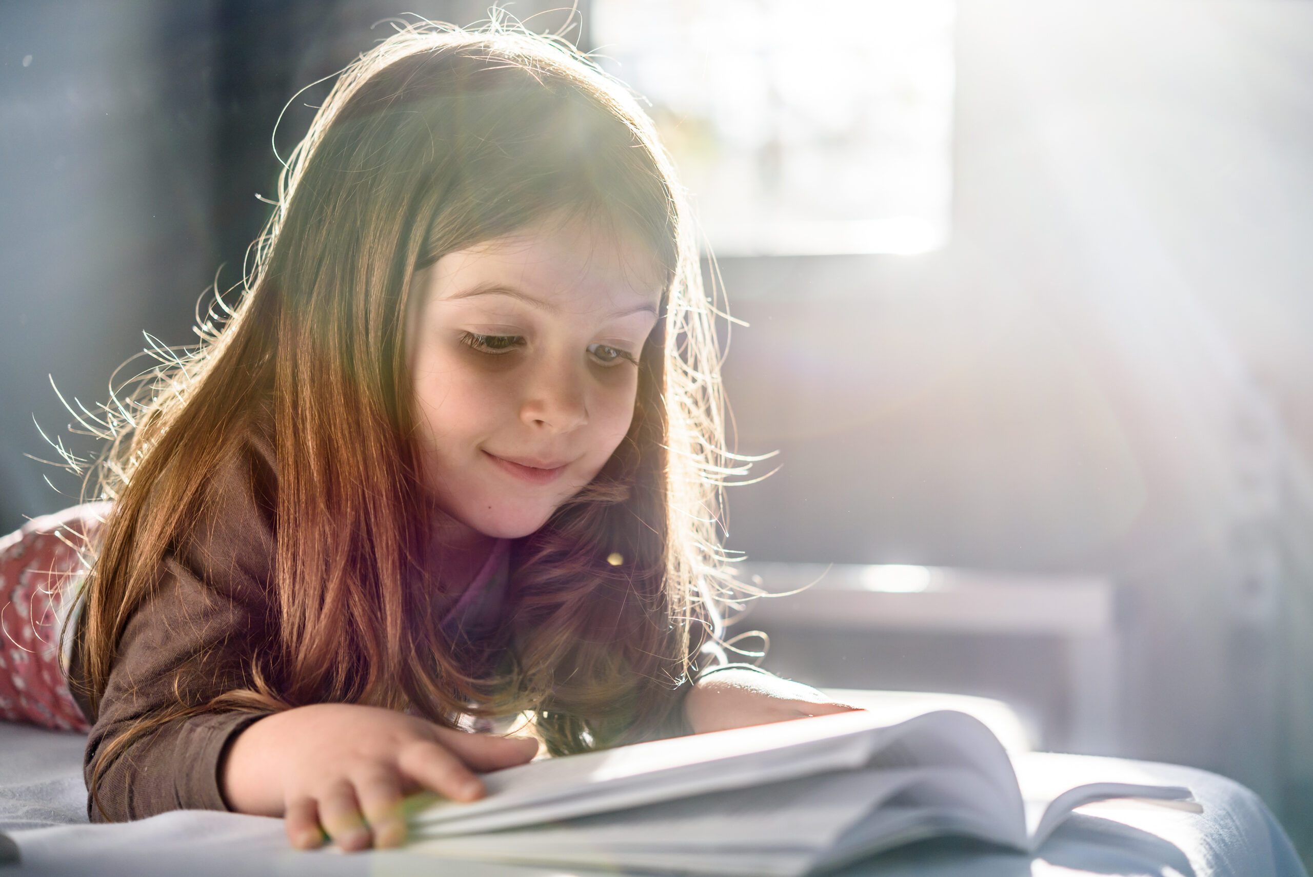 Young girl reading a book