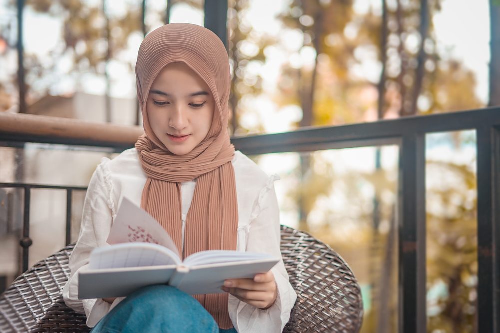 Teen girl reading book