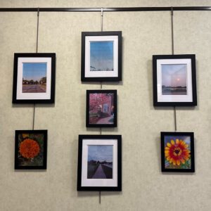 Photography of the featured teen artist on display