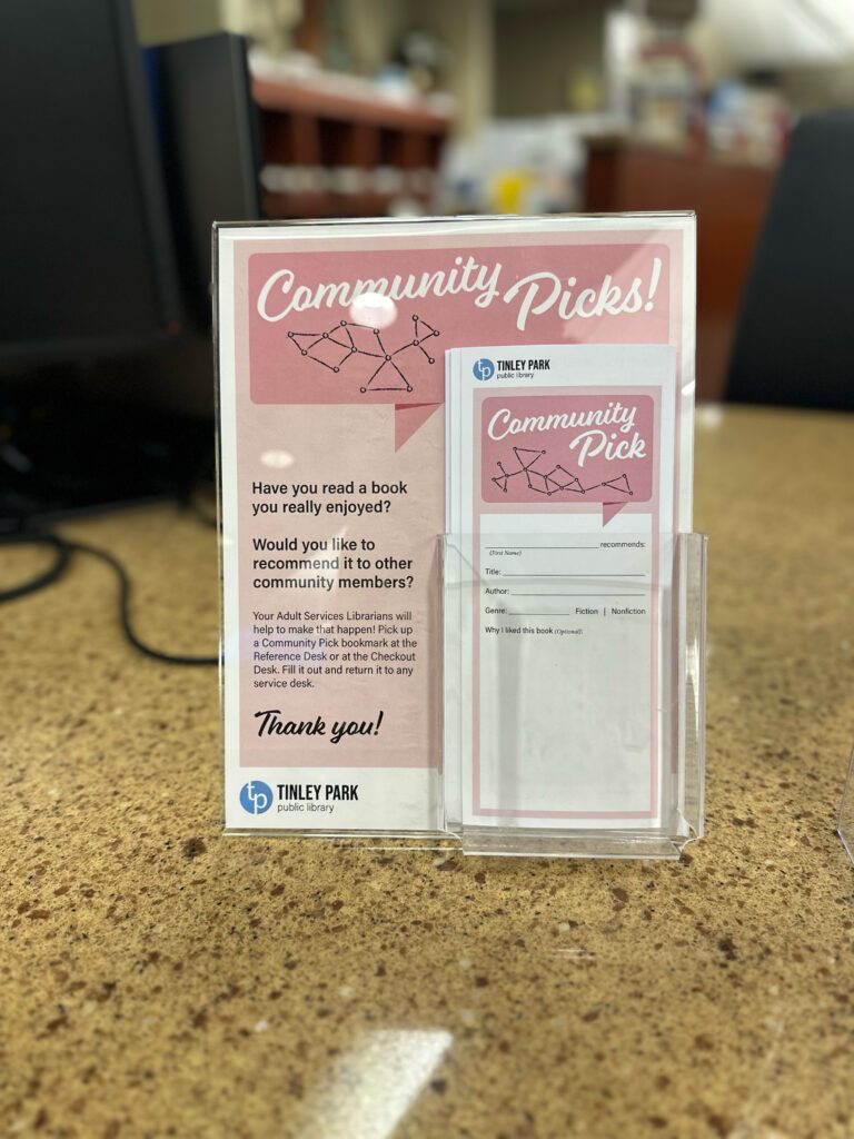 Community Pick bookmarks can be picked up at the Checkout Desk