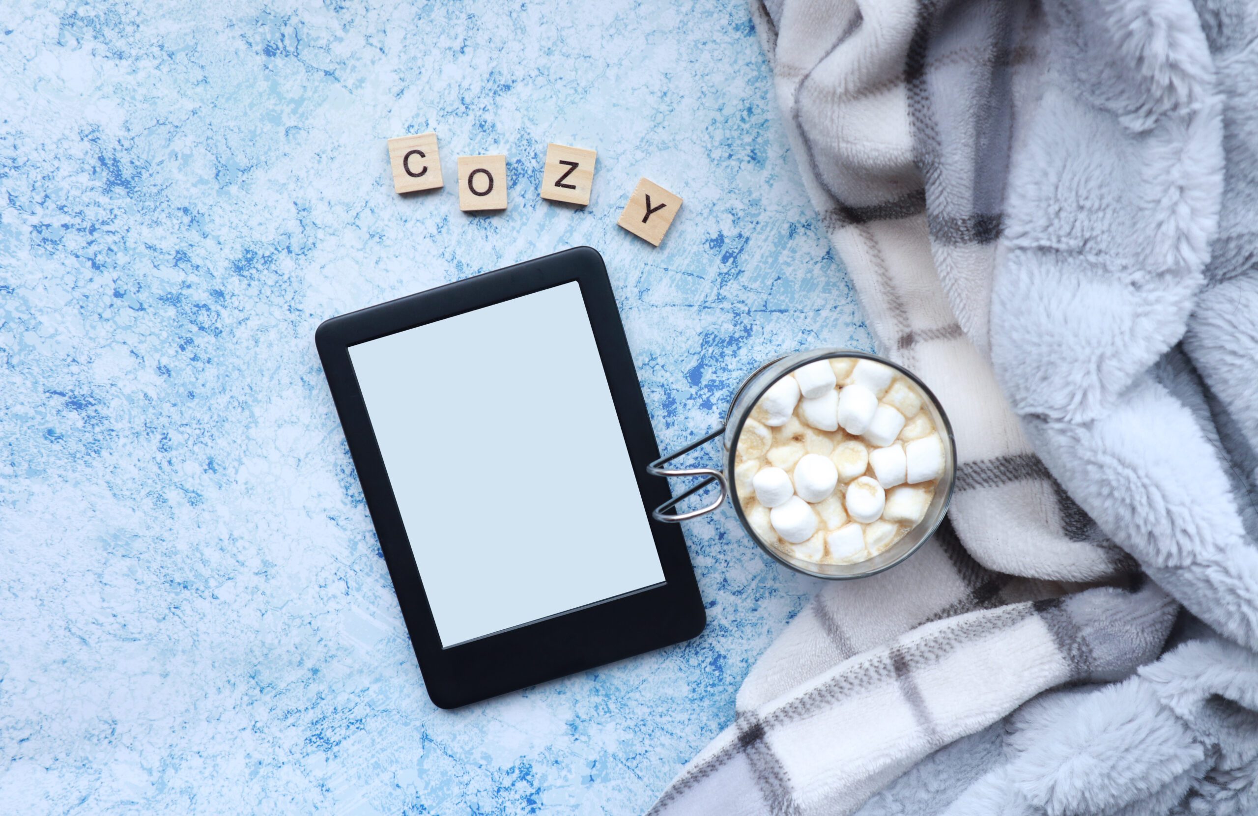 Cozy blanket, hot chocolate and eBook reader