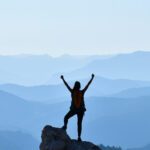 Woman enjoying a new perspective after accomplishing a goal