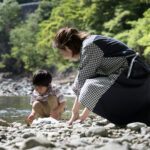 Parent and child enjoying nature in a forest preserve