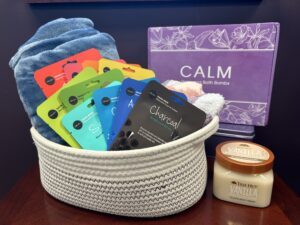 Prize bundle with a cozy blanket, cozy socks (6 pairs), facial sheet masks (12 assorted), vanilla sugar scrub, and bath bombs (20 pieces)