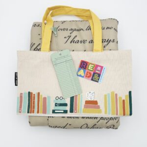 Photo of items in Book Lover Bundle: book-themed fleece blanket, bookshelf tote bag, reading list bookmark, and a Barnes & Noble gift card