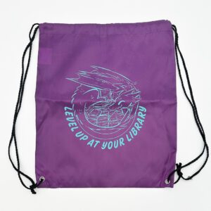 Purple drawstring bag with dragon illustration and words "Level Up at Your Library"