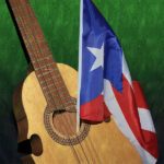 an antique Puerto Rican cuatro with a Puerto Rican flag
