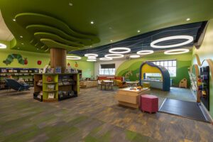 The Play Area, a space where young children can engage with several interactive stations for play and discovery.