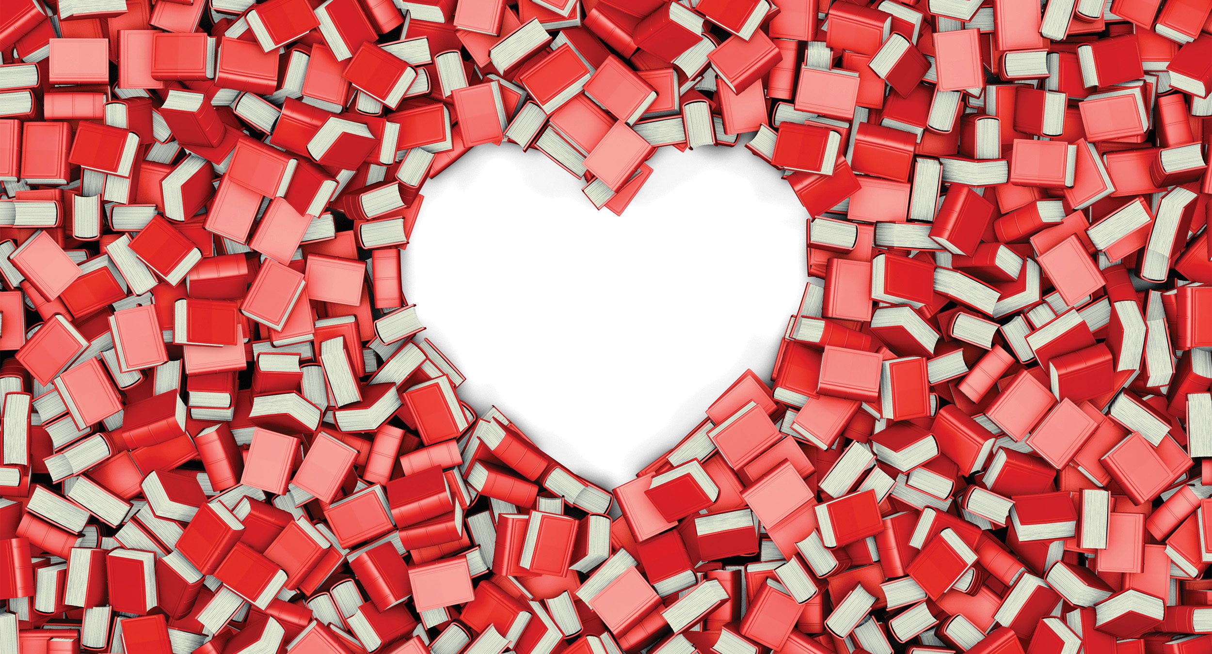 red and pink books scattered around, with a space shaped like a heart in the center