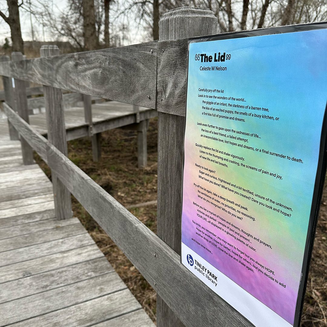 sign on a section of the library boardwalk that has a poem that a local writer entered for the Poetry Walk