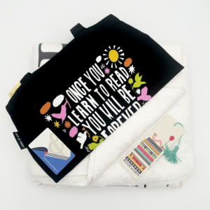 The Book Lover Bundle prize: a soft blanket, a tote bag with a Frederick Douglass quote, a bookworm bookmark, and a Barnes & Noble gift card.