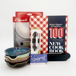 Kitchen Basics Bundle: Better Homes & Gardens 100th Anniversary New Cookbook, a digital food scale, four ceramic spoon rests, a stainless steel magnetic measuring spoons set, and a TJ-Maxx & HomeGoods gift card