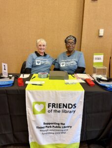 Two members of the Friends of the Library at the Volunteer Fair