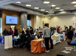 Representatives from various organizations and attendees at the Volunteer Fair