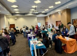 Representatives from various organizations and attendees at the Volunteer Fair